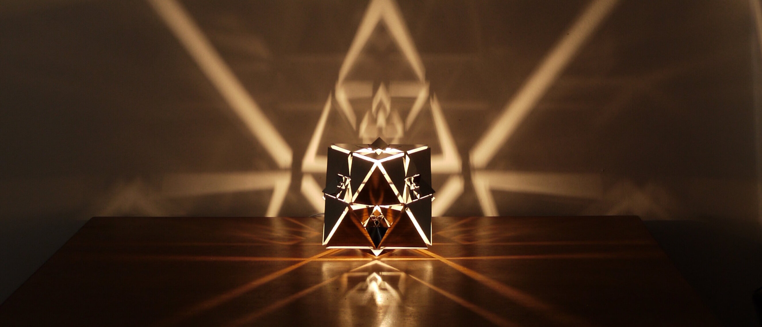 Octahedron Platonic Solid Lamp: Air (Rotated View)
Rotated view of KAGE's Octahedron Platonic Solid Lamp, emphasizing the high-gloss polished stainless steel and detailed design symbolizing the Air element.
