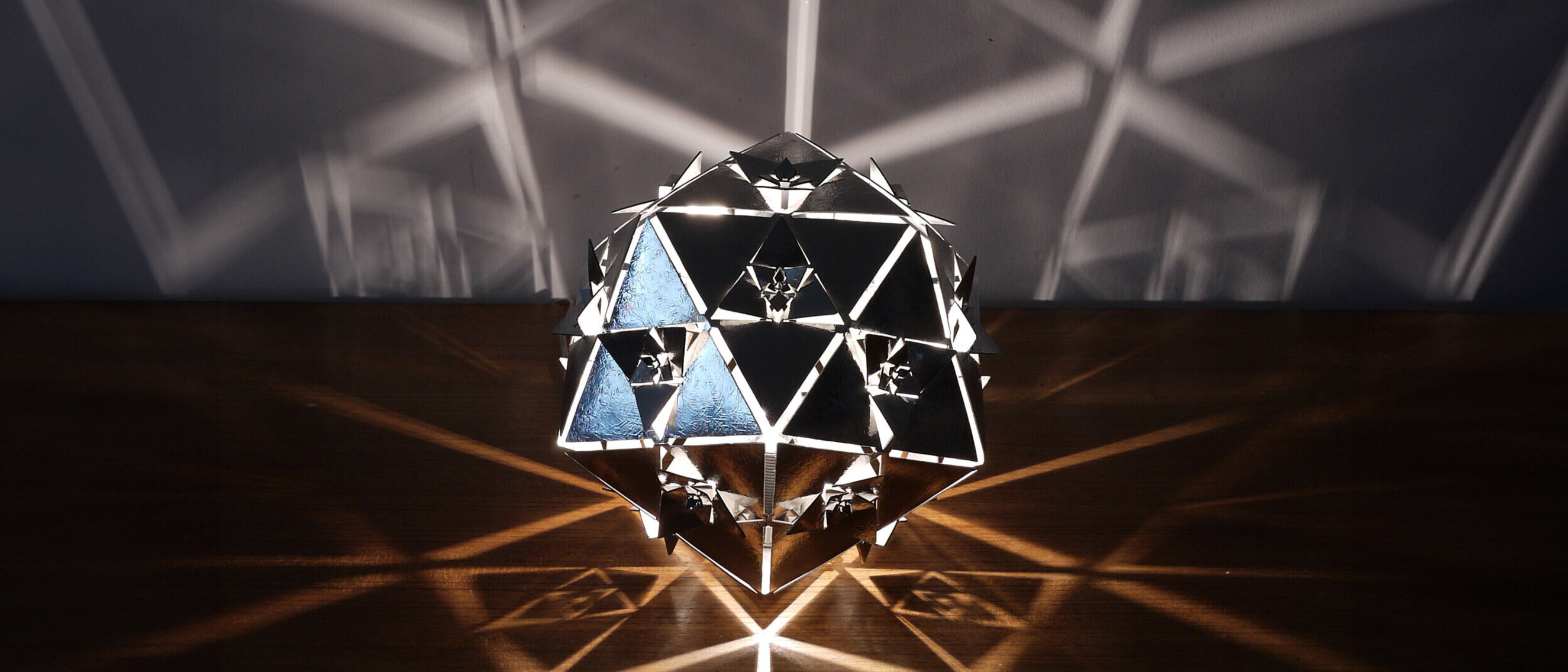 Icosahedron Platonic Solid Lamp: Water (Special Hammered Pattern)
Frontal view of KAGE's special hammered pattern stainless steel Icosahedron Platonic Solid Lamp, encapsulating the rhythmic essence of the Water element.