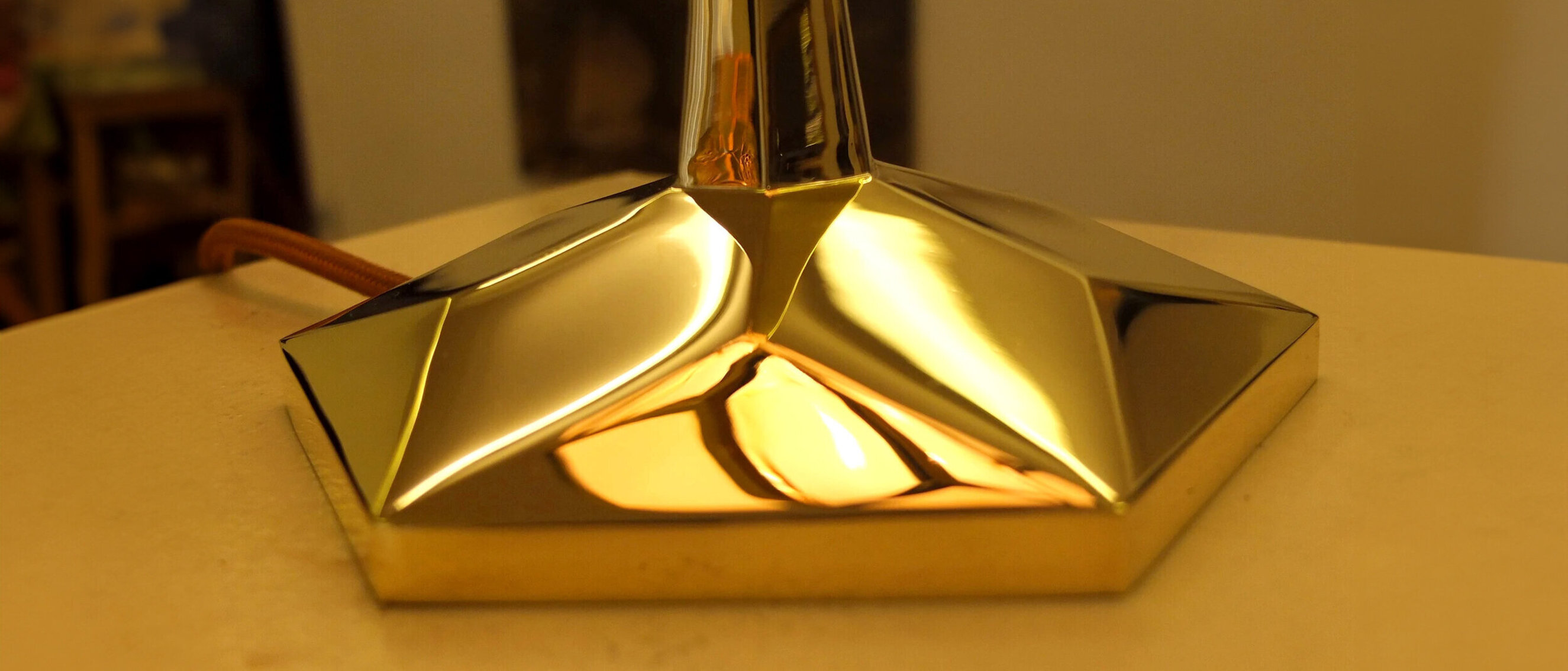 Elegant Base of "The Seed of Life" Lamp
A close-up view of the brass base of "The Seed of Life" lamp with intricate designs.