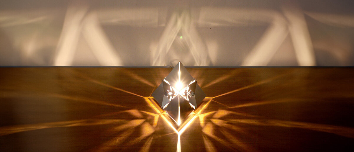 Tetrahedron Platonic Solid Lamp: Fire (Front View)
Front view of KAGE's high-gloss polished stainless steel Tetrahedron Platonic Solid Lamp with intricate fractal patterns symbolizing the Fire element.