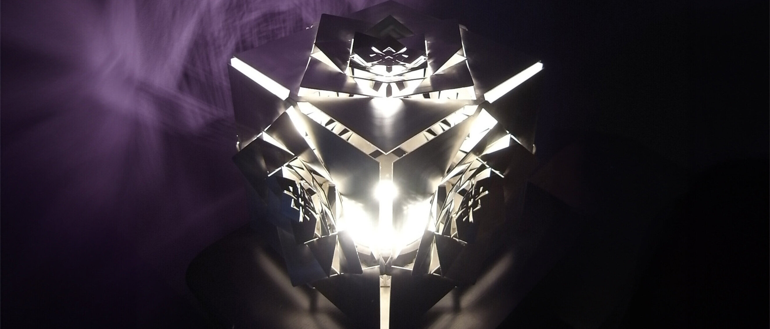 Hexaeder (Cube) Platonic Solid Lamp: Earth (Diagonal View)
Diagonal view of KAGE's Hexaeder (Cube) Platonic Solid Lamp, shimmering in stainless steel, portraying the Earth element through its sacred geometric essence.