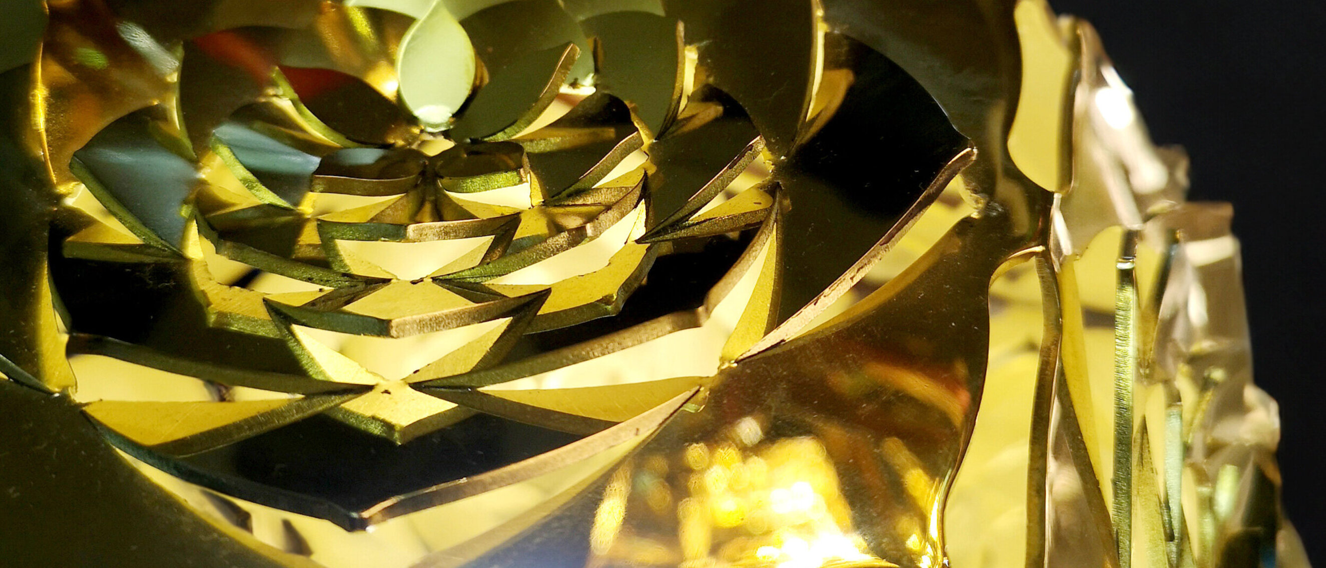 Dodecahedron Platonic Solid Sculpture: The Sun (High-Gloss Finish)
Close-up of KAGE's Dodecahedron Platonic Solid Sculpture "The Sun" with a high-gloss finish, with patterns evoking the brilliance of sun rays, representing Ether.