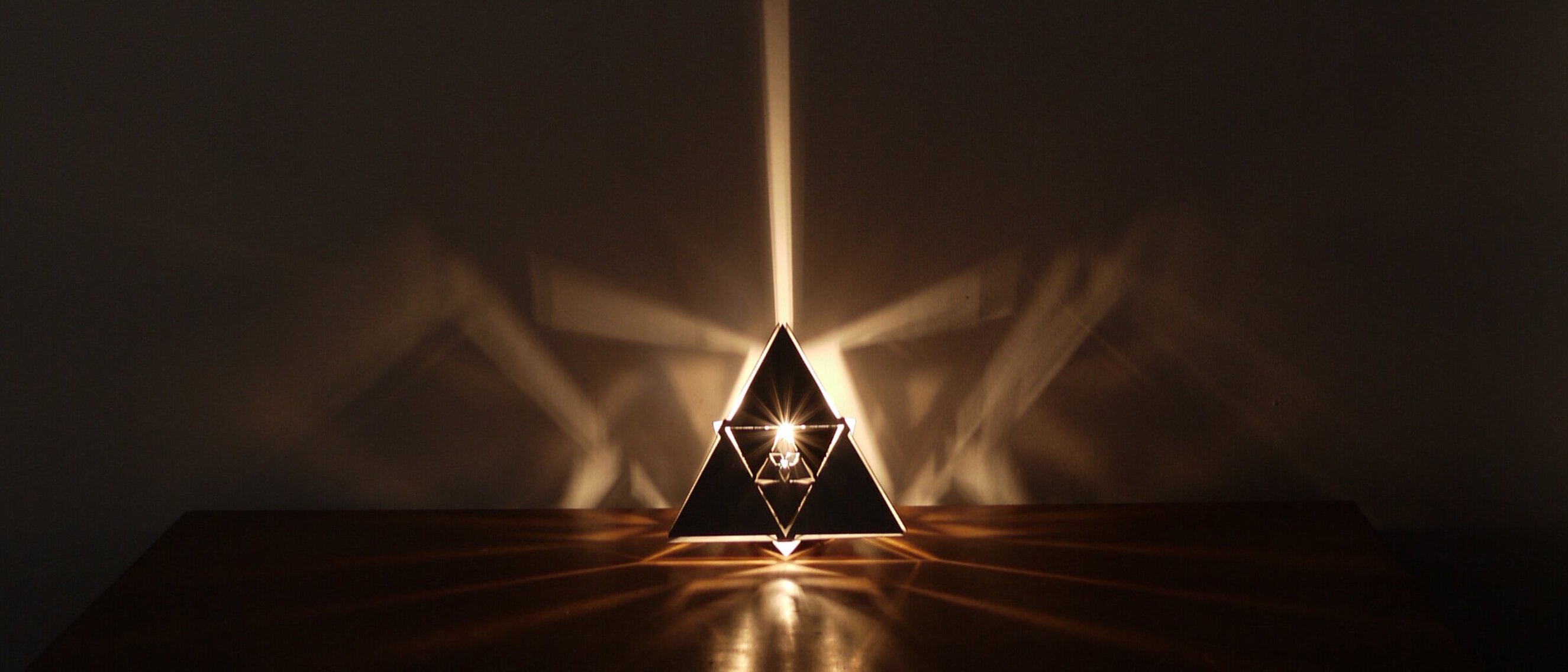 Tetrahedron Platonic Solid Lamp: Fire (Rotated View)
Rotated view of KAGE's Tetrahedron Platonic Solid Lamp, highlighting the high-gloss polished stainless steel and intricate fractal patterns symbolizing Fire.